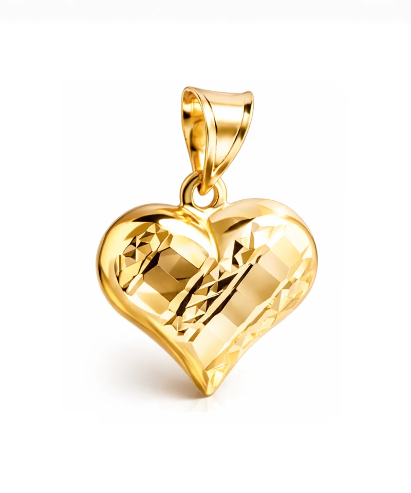 Złota zawieszka próby 585 w kształcie serca, obustronnie wypukła, z frezowanym wzorem z jednej strony i gładką powierzchnią z drugiej.